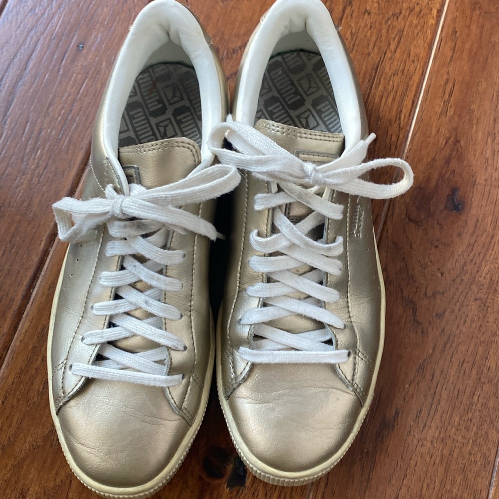 Gold puma sneakers